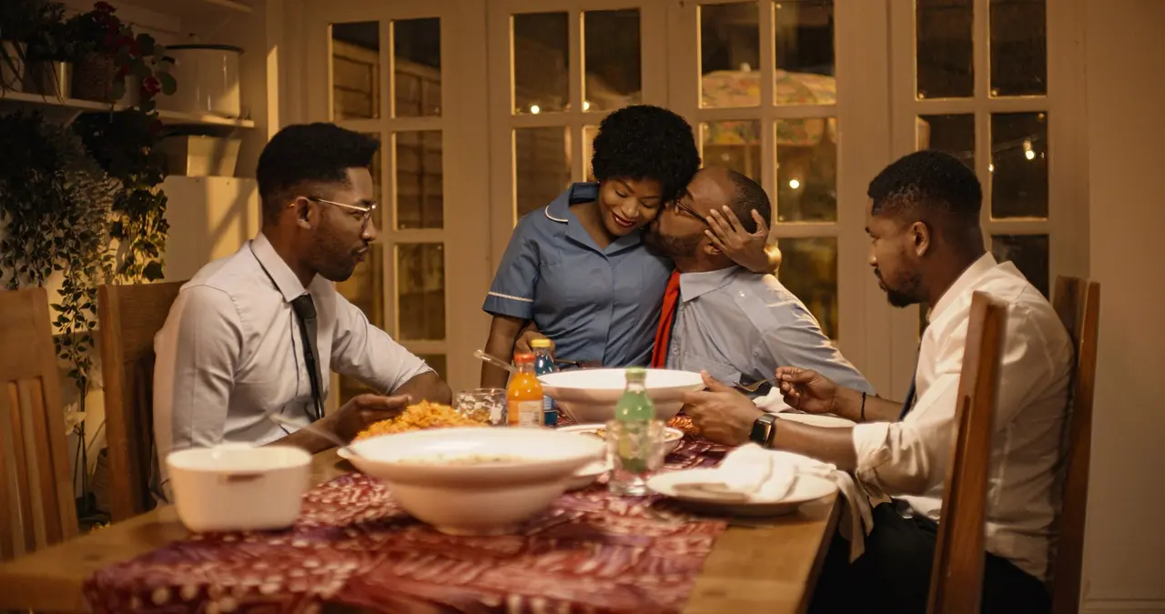 The Baba-Lola family gathered around the dinner table
